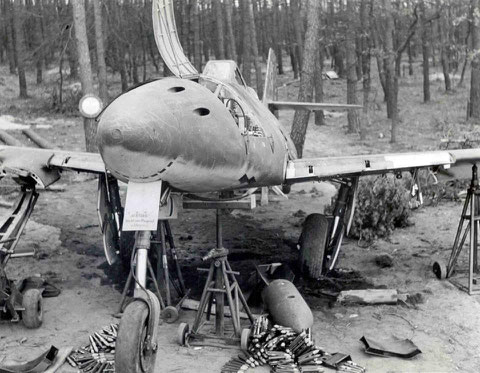 No. 1) The aircraft is resting on jacks while the starboard wing is supported by a hydraulic lifting device. These devices were used to mount and un-mount the engines.