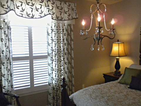  Shutters were already in place for privacy and light control. See how we achieved romance and softness with drapery and valance over the shutters.