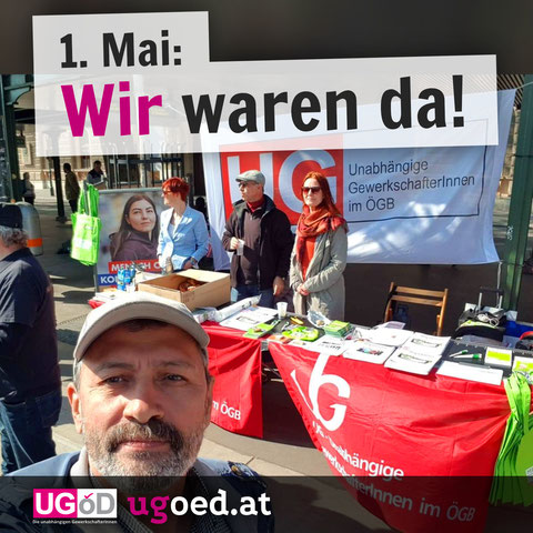 Erster Mai: Wir waren da! Auf der Wiener Ringstraße stehen Elke, Hasan und Mesud mit dem traditionellen Info-Stand der UG.