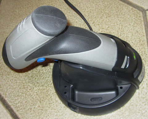 The Dremel Cordless Screwdriver on his original Dremel charger