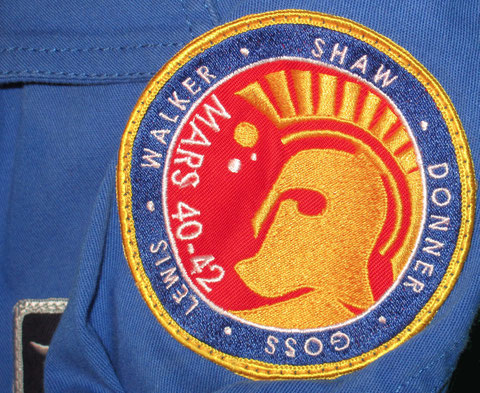 defying gravity maddux donner mars mission patch on instructor flightsuit