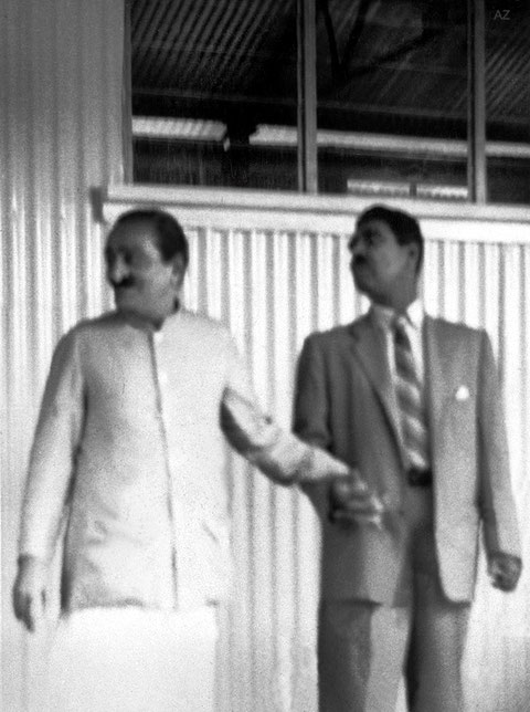 5th June 1958 ; Meher Baba with Eruch Jessawala outside his house. Photo taken by Colin Adams. Courtesy of Avatar Abode Archives.