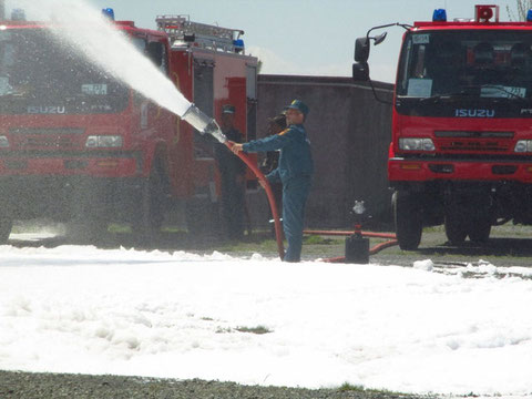 Firefighter spraying chemical water with the equipment procured (Location: Lusakert May 2019)