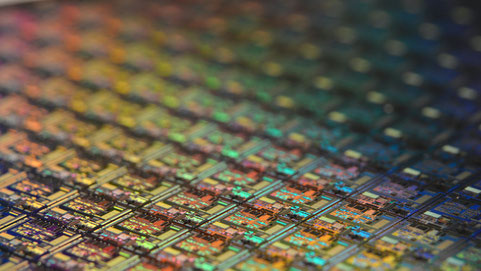 Silicon wafer. Each square is a chip with microscopic transistors and circuits.