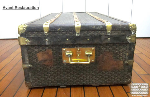 Malle goyard abimé, cuir taché. poignée laiton