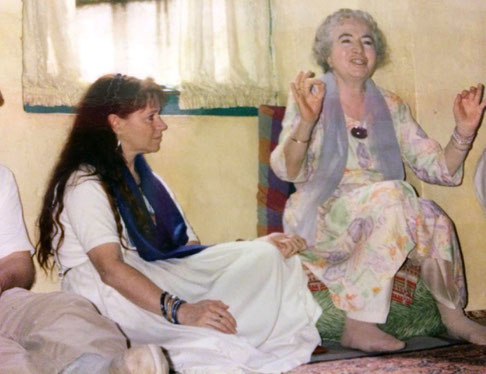 Mandali Hall, Meherazad, India. Mani telling a story with Raine Eastman-Garnett next to her.