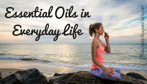 Kathleen Ellerie sitting on beach inhaling essential oil