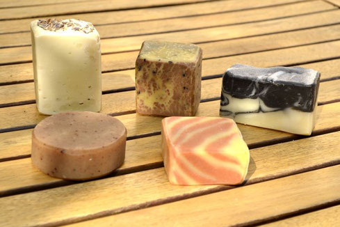 Clockwise : round spice soap (essential oils black pepper, ylang-ylang, clove), lavender soap, red dragon soap (with black sesame), black & white soap, catalan soap (red and yellow stripes).