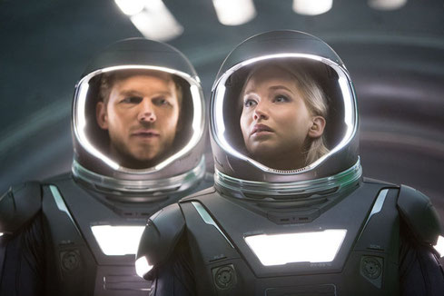 Chris Pratt and Jennifer Lawrence in space suits, about to take a walk outside.  Image from the movie Passengers, courtesy of Sony Pictures. 