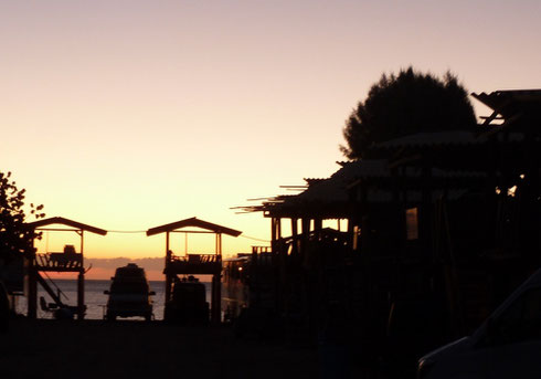 Sunrise over palapas in San Felipe