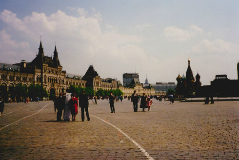 Red Square, with the GUM department store to the left, St. Basil's Cathedral in the middle and Lenin's Tomb to the right. Behind the tomb is the Kremlin.