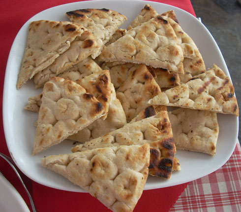 2011 Mykonos - Freshly Baked Pita at Babulos Taverna overlooking Mykonos Harbor 