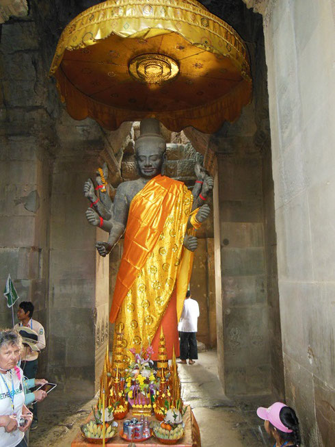 2015 Pilgrims honor a Figure of the Lord Buddha in the Lower Level Gallery at Angkor Wat