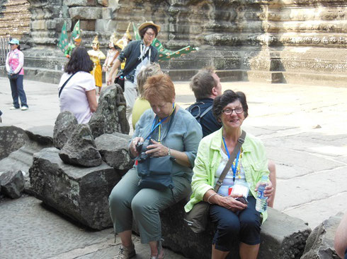 2015 A group of Travelers take a Brief Rest after reaching the Second Level of Angkor Wat