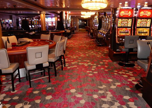 Try your Luck at slots or table games in the Casino aboard Norwegian Gem 