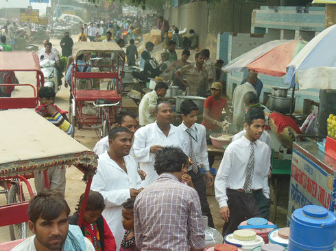 2013 Lunchtime on a street in New Delhi can be quite congested with Rickshaw traffic