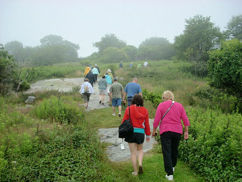 An Adventure Tours Group Making their Way up to the Summit of House Island