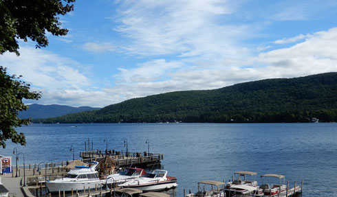 A view of Lake George with boats in the foreground