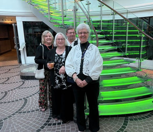2026 A Group of Passengers at the Foot of Norwegian Breakaway's Grand Staircase