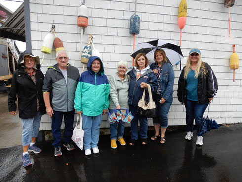 Rain or Shine we always have a Good Time - Passengers with umbrellas