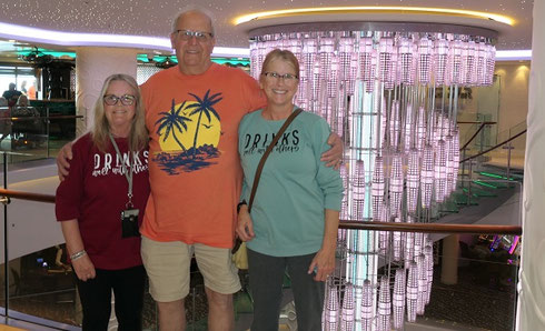 2025 Passengers Pose in Front of the Atrium aboard Norwegian Getaway