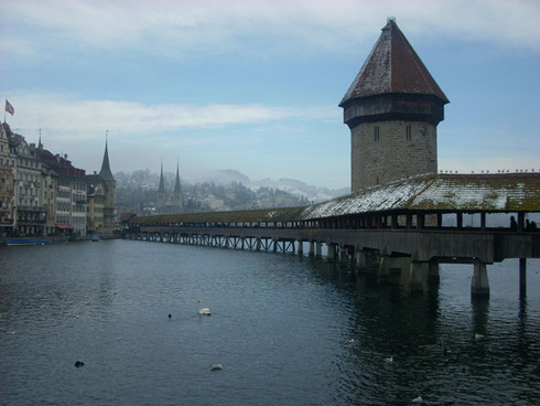 The Foot Bridge and Covered Walkway in Lucerne, Switzerland, Looks Good Even in the Rain