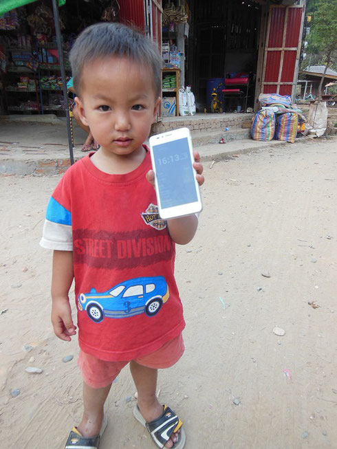 2015 This Cute Child was anxious to show us his new Cell Phone