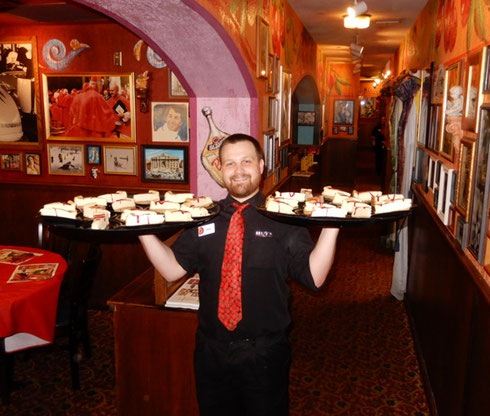 Cheesecake anyone?  Look at the knowing smile on this waiter at Buca di Beppo