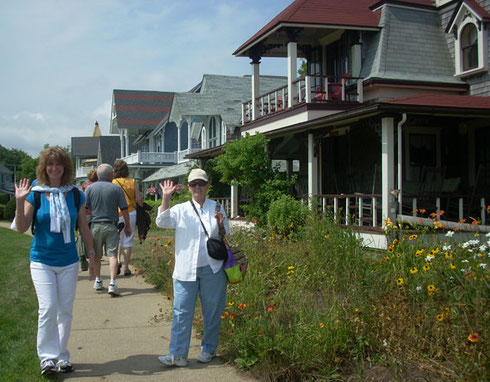 A big hello from Adventure Tours travelers near the painted cottages at Oak Bluffs