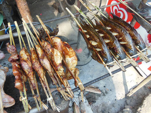 2015 Grilled meats and fish sold by vendors at a tiny village at the entrance to the falls