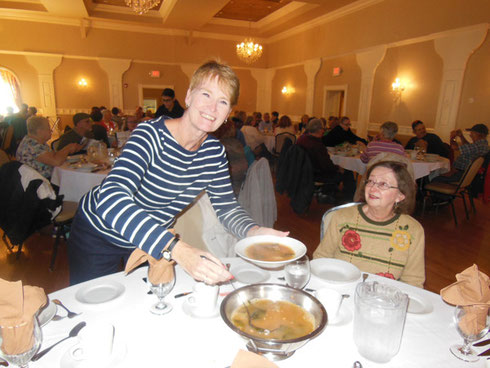 A Passenger Serves Traditional Portuguese Kale Soup to her Tablemates