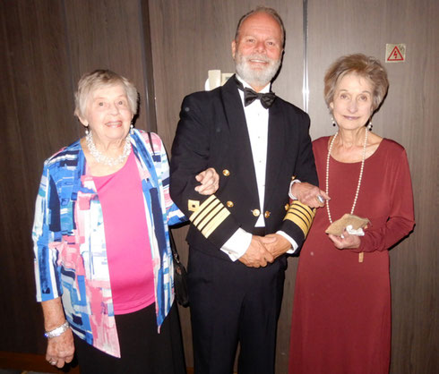 2019 Passengers Posing with the Captain on a Canadian Cruise aboard the Norwegian Dawn