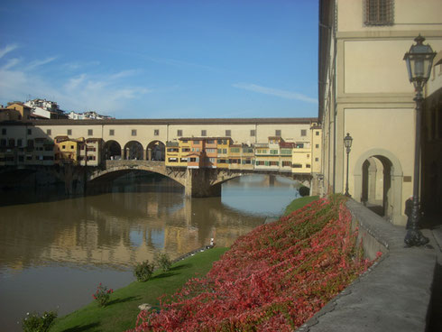 The Medieval Ponte Vecchio spans the Arno River in Florence - Unforgettable Sight to See