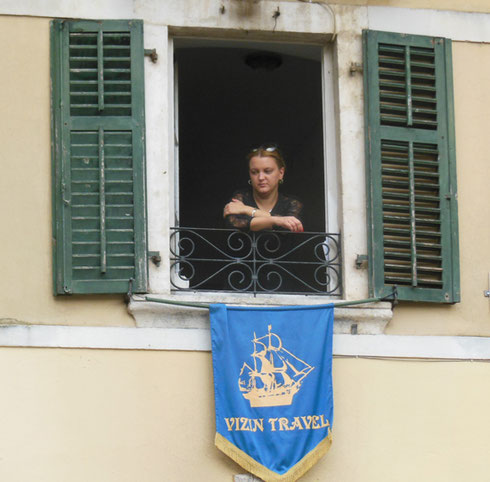 One of the Local Women Looks Quietly out her Window in Montenegro