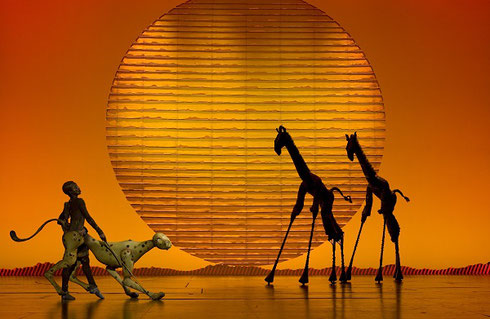 Circle of Life Cheetah and Giraffes before an Image of the Sun - Photo by Joan Marcus