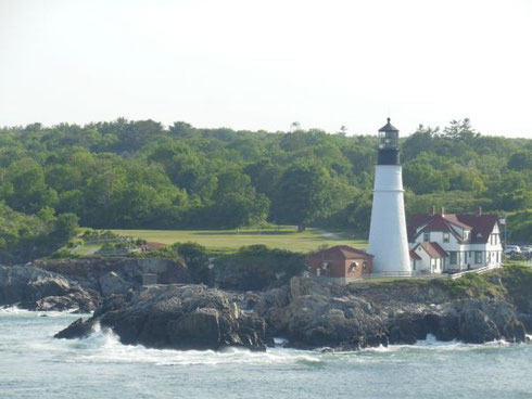 The Iconic Portland Lighthouse Towers over the Rocky Coast as you Enter Portland Harbor