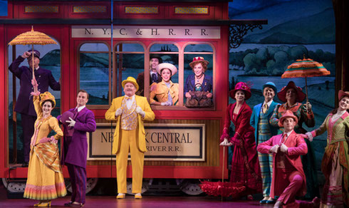 A group on the streetcar set of Hello Dolly!