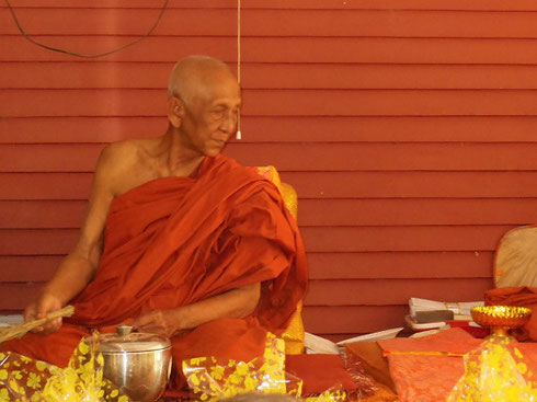 2015 A Monk at the Rolous Pagoda at Bakong accepts and blesses our Offerings