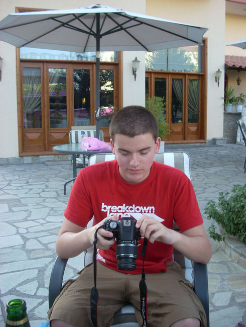 2011 Kalambaka - Our Youngest Passengers checking Photographs outside the Hotel Famissi