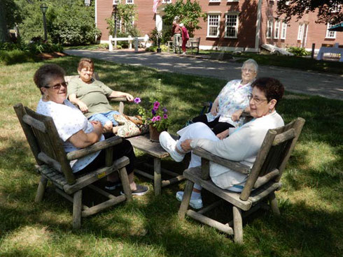 This Group Enjoyed the View of Wayside Inn's Gardens in a Comfortable Shady Setting