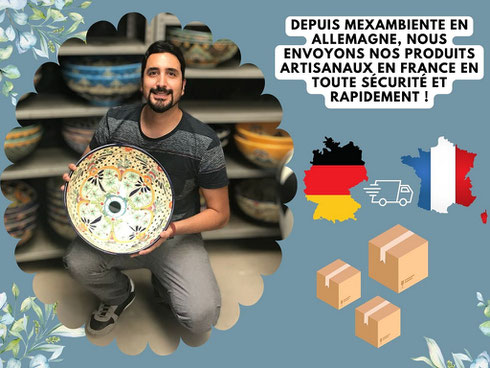 Homme tenant un lavabo mexicain peint à la main dans un entrepôt, avec des icônes de livraison entre l’Allemagne et la France – expédition sécurisée par Mexambiente