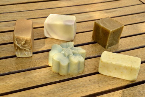 Clockwise from left: honey and wax soap (lemon scent), lavender soap, coffee soap, oat and sheabutter soap, mint soap.