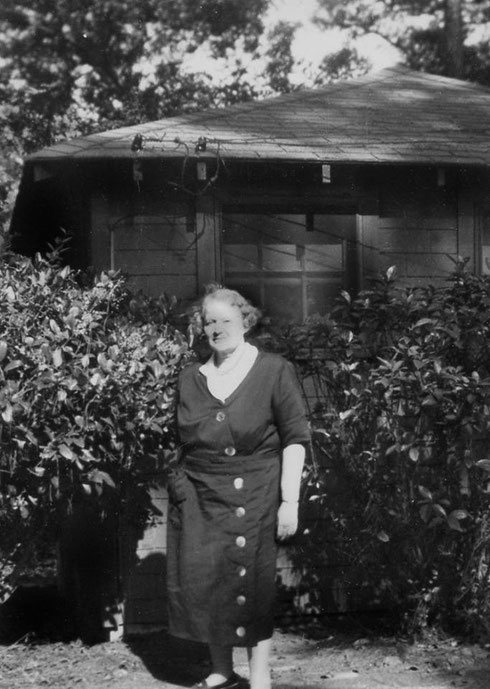 Photo courtesy of Charles Haynes :Elizabeth in front of the Lagoon Cabin at Meher Spiritual Center