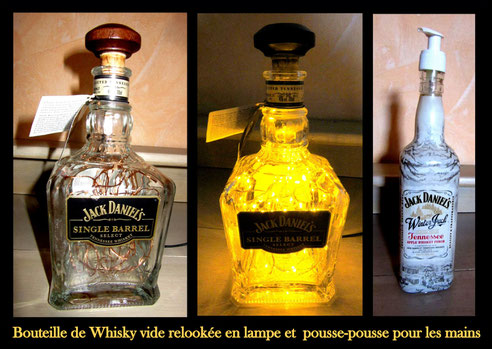 Bouteille de Whisky vide relookée en lampe et pousse-pousse pour les mains 