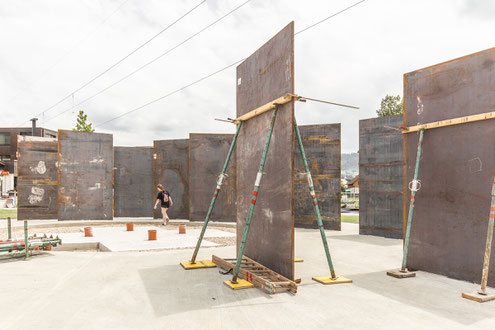 construction site of the sculptural spatial intervention for the Welser Profile Community Center in Gresten, lower Austria. parametric architecture made of massive Corten steel Panels. 