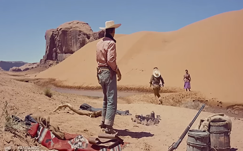 John Wayne in "The Searchers" on location in Monument Valley: the place is called Sand Spring.