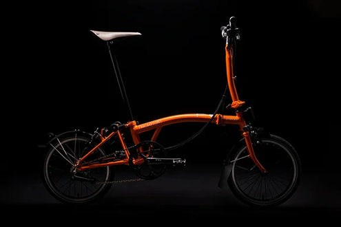 Neko Case x Crew Nation x Brompton Bike Orange main frame, orange extremities. Gun toting orca on main frame. Designed on M6L Black Edition.