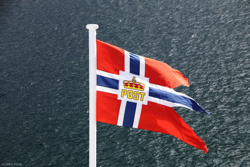 The Hurtigruten flag is waving at the stern of each ship, it is taken over overnight.