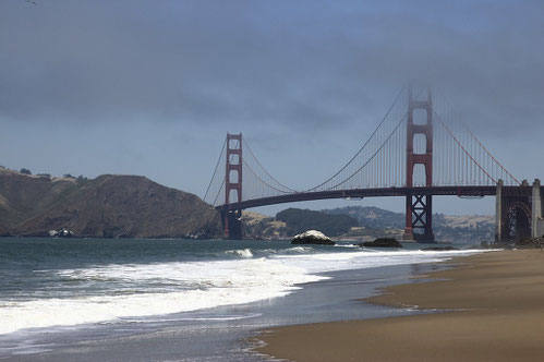 Clouds and fog at Colden Gate Bridge at the beach