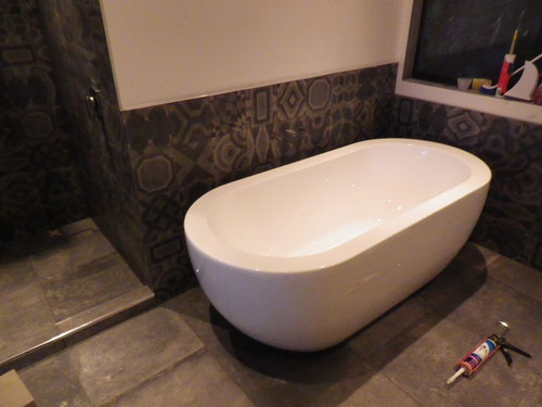 Bath in, and plumbed into the bathroom next door.